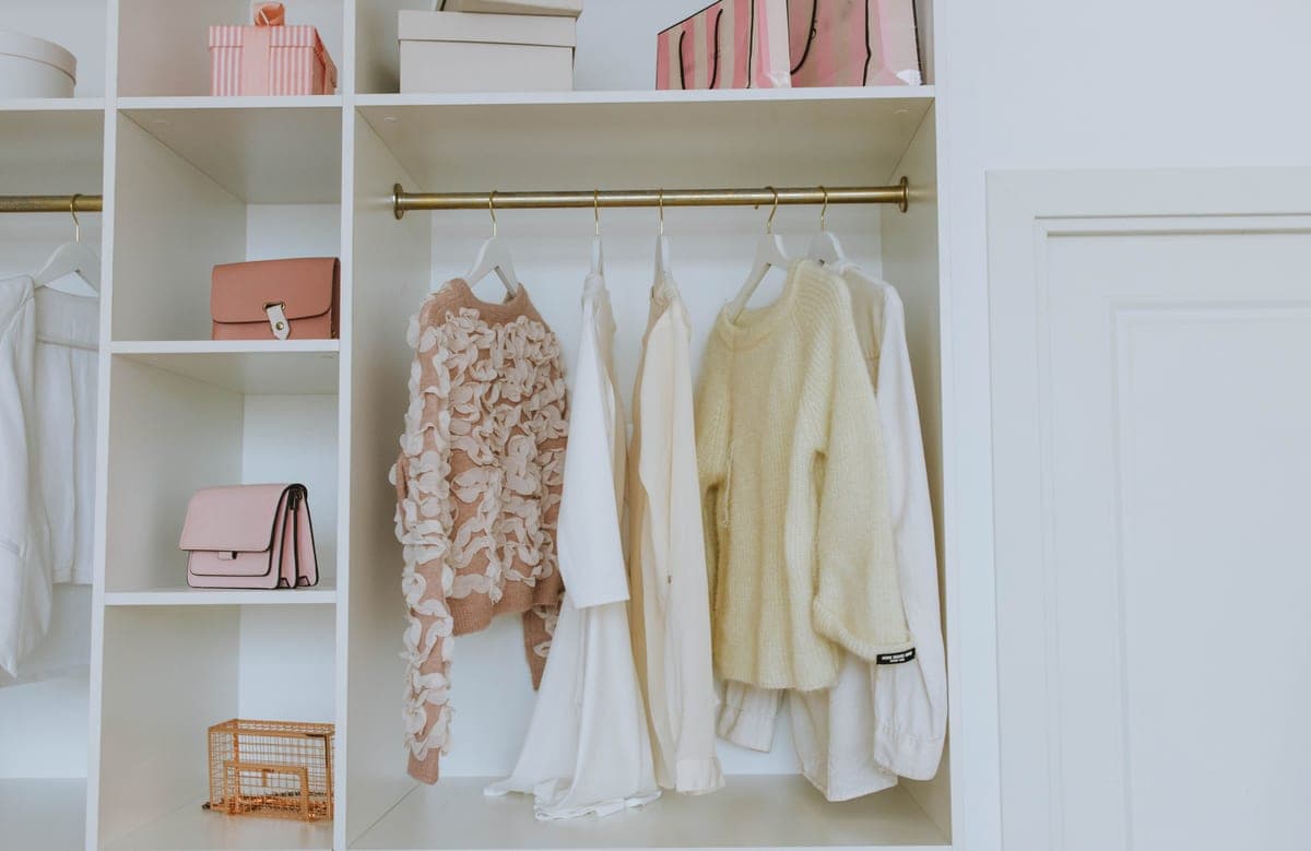 Closet shelving holding folded clothes